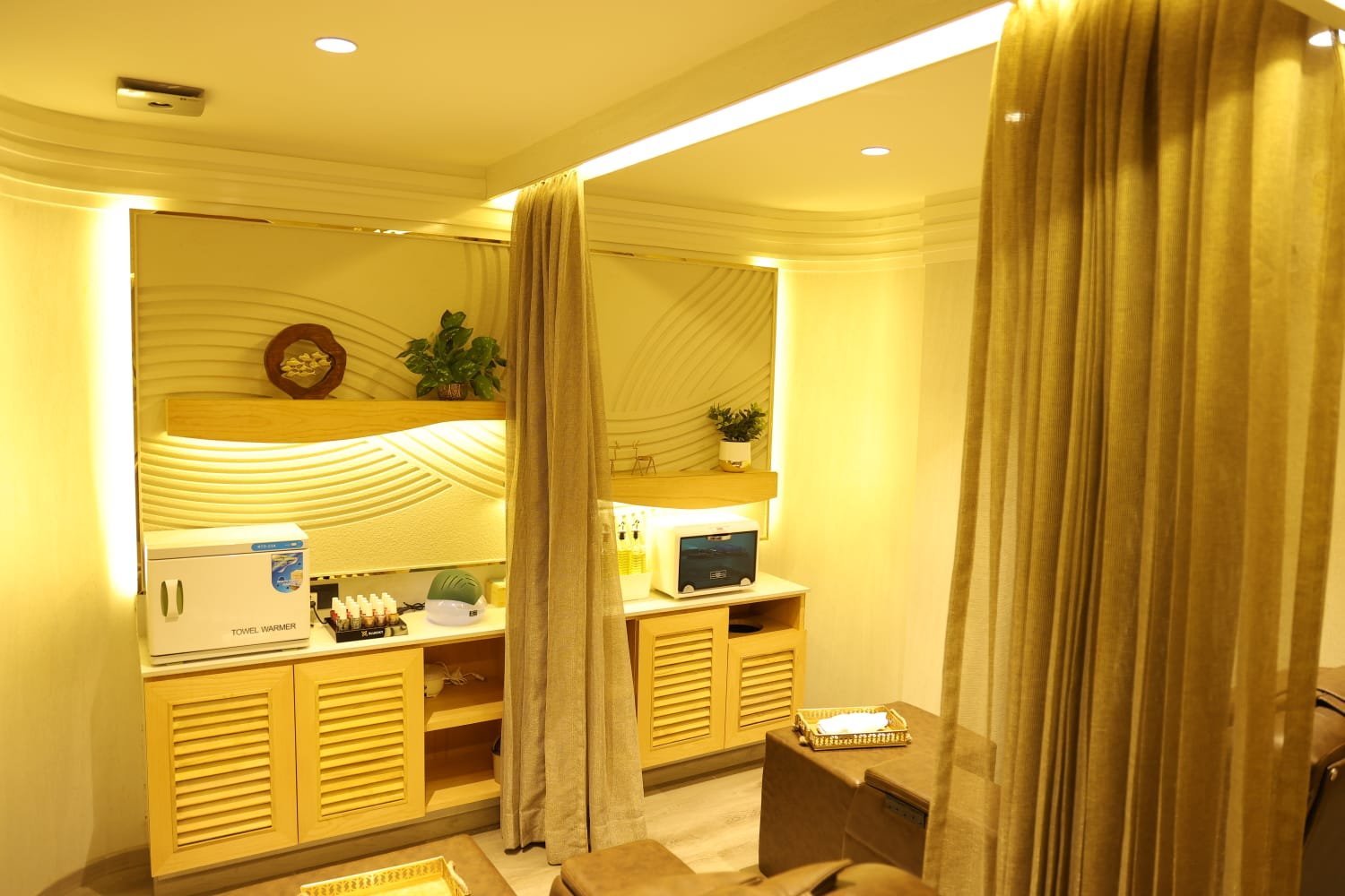 Waiting lounge and product display at Page 3 Salon, Saligramam