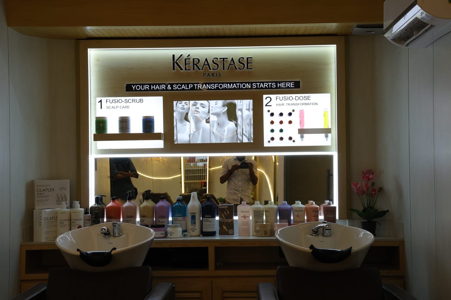 Kérastase wash bay and product wall at Page 3 Salon, Saligramam
