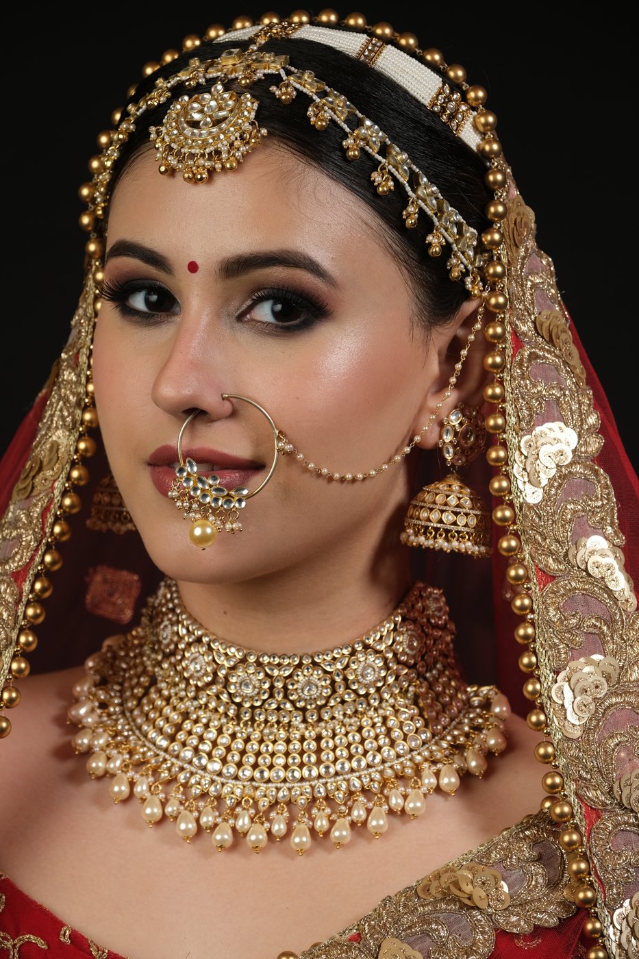 Close-up of bridal makeup and jewellery detailing at Page 3 Salon